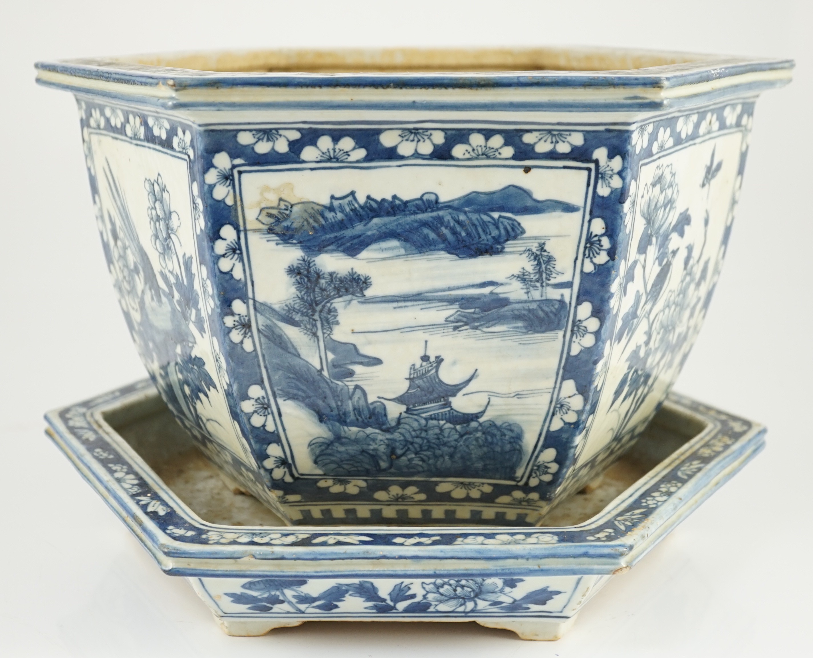 A Chinese hexagonal blue and white planter and underdish, 19th century, 35cm wide, two rim chips